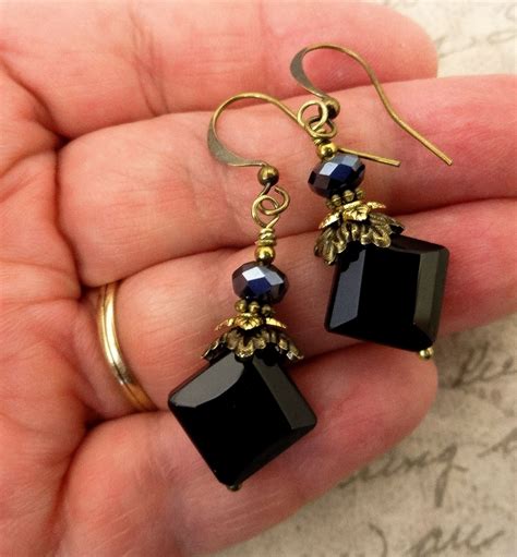 black and gold faceted earrings.